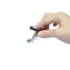 Lente con pinzetta di sostegno